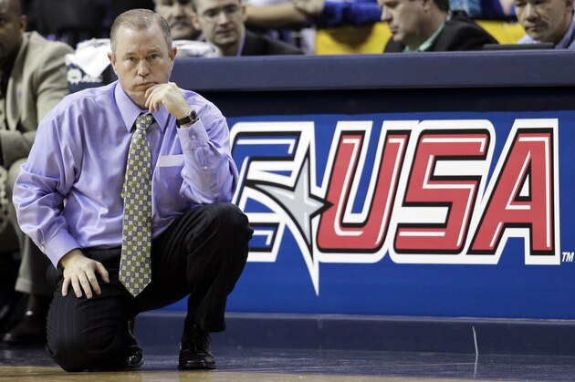 Marshall head coach Tom Herrion watches his team play Memphis in the second half of an NCAA college basketball game against Memphis in the championship of the Conference USA tournament on Saturday, March 10, 2012, in Memphis, Tenn.  Memphis beat Marshall 83-57.(AP Photo/Mark Humphrey)