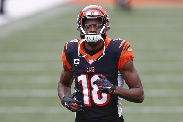 FILE - In this Sunday, Jan. 3, 2021 file photo, Cincinnati Bengals wide receiver A.J. Green (18) warms up before an NFL football game against the Baltimore Ravens in Cincinnati. The Arizona Cardinals made a pair of big offseason moves, adding seven-time Pro Bowl receiver A.J. Green on a one-year deal and trading for three-time Pro Bowl center Rodney Hudson.  (AP Photo/Aaron Doster, File)