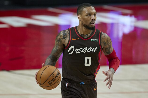 Portland Trail Blazers guard Damian Lillard brings the ball up court against the Golden State Warriors during the first half of an NBA basketball game in Portland, Ore., Wednesday, March 3, 2021. (AP Photo/Craig Mitchelldyer)