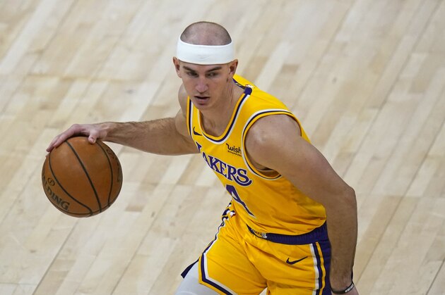 Los Angeles Lakers guard Alex Caruso (4) brings the ball up court in the second half during an NBA basketball game against the Utah JazzWednesday, Feb. 24, 2021, in Salt Lake City. (AP Photo/Rick Bowmer)