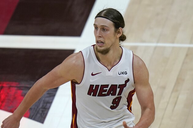 Miami Heat forward Kelly Olynyk (9) runs up court in the second half during an NBA basketball game against the Utah Jazz Saturday, Feb. 13, 2021, in Salt Lake City. (AP Photo/Rick Bowmer)