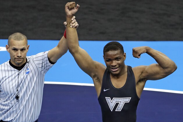 Virginia Tech's Mekhi Lewis, right, celebrates his win over Penn State's Vincenzo Joseph in their 165-pound bout in the finals of the NCAA wrestling championships Saturday, March 23, 2019, in Pittsburgh. (AP Photo/Gene J. Puskar)