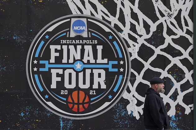 The NCAA Final Four logo for the NCAA college basketball tournament is painted on a window in downtown Indianapolis, Wednesday, March 17, 2021. (AP Photo/Darron Cummings)