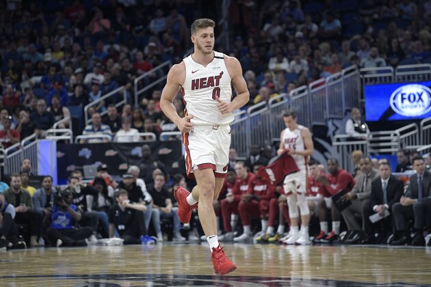 Miami Heat forward Meyers Leonard (0) runs up the court after a play during the first half of an NBA basketball game against the Orlando Magic Friday, Jan. 3, 2020, in Orlando, Fla. (AP Photo/Phelan M. Ebenhack)