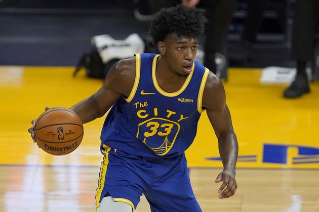 Golden State Warriors center James Wiseman (33) dribbles against the Utah Jazz during the first half of an NBA basketball game in San Francisco, Sunday, March 14, 2021. (AP Photo/Jeff Chiu)