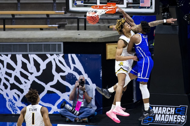 Drake's JosephÂ Yesufu (1) dunks on Wichita State's Clarence Jackson during the first half of a First Four game in the NCAA men's college basketball tournament Thursday, March 18, 2021, at Mackey Arena in West Lafayette, Ind. (AP Photo/Robert Franklin)