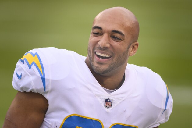 Los Angeles Chargers running back Austin Ekeler (30) laughs with teammates before the first half of an NFL football game against the Kansas City Chiefs, Sunday, Jan. 3, 2021, in Kansas City, Mo. (AP Photo/Reed Hoffmann) Los Angeles Chargers running back Austin Ekeler (30) laughs with teammates before the first half of an NFL football game against the Kansas City Chiefs, Sunday, Jan. 3, 2021, in Kansas City, Mo. (AP Photo/Reed Hoffmann)