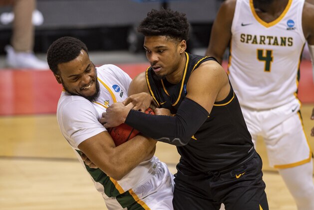 Norfolk State forward J.J. Matthews (15), left, and Appalachian State guard Justin Forrest (1) battle for the ball during the first half of a First Four game in the NCAA men's college basketball tournament, Thursday, March 18, 2021, in Bloomington, Ind. (AP Photo/Doug McSchooler)