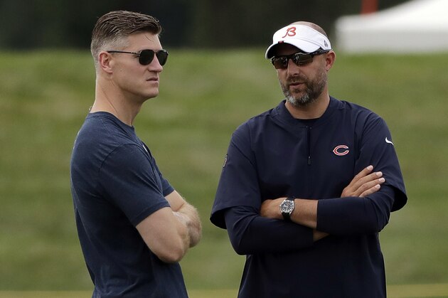 FILE - In this July 26, 2019, file photo, Chicago Bears head coach Matt Nagy, right, talks with general manager Ryan Pace during NFL football training camp in Bourbonnais, Ill. The Bears and every other team around the NFL are staring at a season like no other because of the COVID-19 pandemic. Veterans started reporting to camps this week. But instead of jumping right into the grind, they're taking a slower approach  (AP Photo/Nam Y. Huh, File)