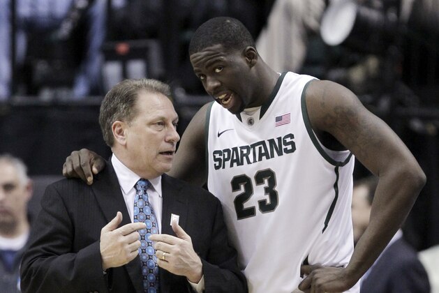 Michigan State head coach Tom Izzo talks to Michigan State forward Draymond Green (23) in the first half of an NCAA college basketball game against Iowa in the second round of the Big Ten Conference tournament in Indianapolis, Friday, March 9, 2012. (AP Photo/Michael Conroy)
