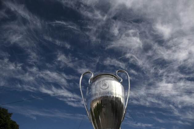 A giant replica of the UEFA Champions League trophy is displayed at the Rossio square downtown Lisbon, Portugal, Friday, Aug. 21, 2020. PSG will play Bayern in the Champions League final on Sunday. (AP Photo/Manu Fernandez)