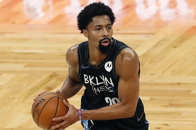 Brooklyn Nets' Spencer Dinwiddie plays against the Boston Celtics during the first half of an NBA basketball game, Friday, Dec. 25, 2020, in Boston. (AP Photo/Michael Dwyer)
