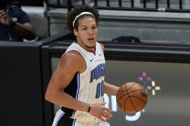 Orlando Magic forward Aaron Gordon takes the ball down court during the second half of an NBA basketball game against the Miami Heat, Thursday, March 11, 2021, in Miami. (AP Photo/Wilfredo Lee)