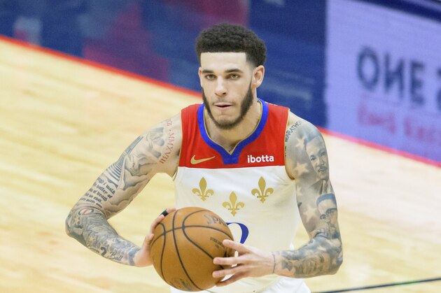 New Orleans Pelicans guard Lonzo Ball (2) passes in the second half of an NBA basketball game against the Cleveland Cavaliers in New Orleans, Friday, March 12, 2021. (AP Photo/Matthew Hinton)