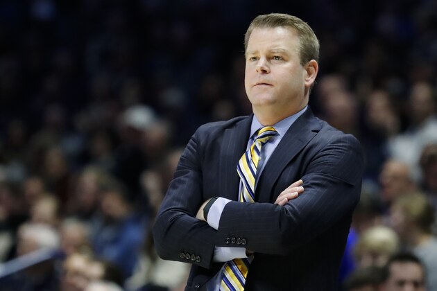 Marquette head coach Steve Wojciechowski works the bench during the second half of an NCAA college basketball game against Xavier, Wednesday, Jan. 29, 2020, in Cincinnati. (AP Photo/John Minchillo)