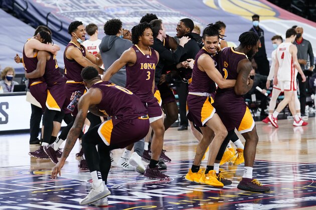 Iona players celebrate after winning an NCAA college basketball game against Fairfield during the finals of the Metro Atlantic Athletic Conference tournament, Saturday, March 13, 2021, in Atlantic City, N.J. (AP Photo/Matt Slocum)