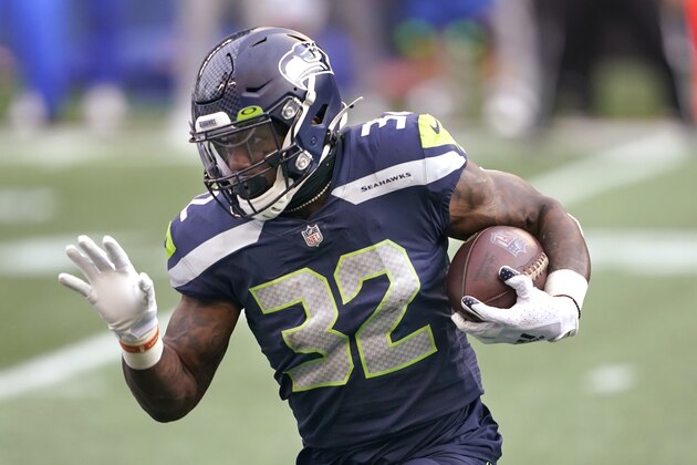 Seattle Seahawks running back Chris Carson in action against the Los Angeles Rams during the first half of an NFL wild-card playoff football game, Saturday, Jan. 9, 2021, in Seattle. (AP Photo/Ted S. Warren)