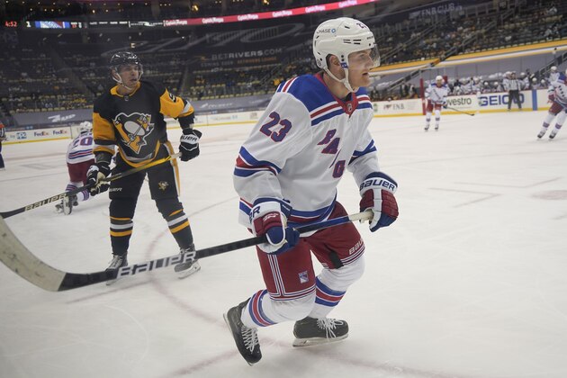 New York Rangers' Adam Fox (23) plays against the Pittsburgh Penguins during an NHL hockey game, Sunday, March 7, 2021, in Pittsburgh. (AP Photo/Keith Srakocic) New York Rangers' Adam Fox (23) plays against the Pittsburgh Penguins during an NHL hockey game, Sunday, March 7, 2021, in Pittsburgh. (AP Photo/Keith Srakocic)