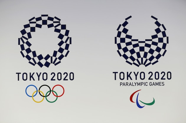 FILE - In this April 25, 2016, file photo, official logos of the 2020 Tokyo Olympics, left, and the 2020 Tokyo Paralympic Games are displayed by the Tokyo Organizing Committee, in Tokyo. Tokyo Olympic organizers said Monday, Sept. 30, 2019 they are investigating the fraudulent purchase of 6,900 tickets worth 180 million yen ($1.67 million) that were obtained in an online lottery for Japan residents. Organizers said they were in the process of voiding the tickets but did not suggest who was involved. (AP Photo/Shizuo Kambayashi, File)