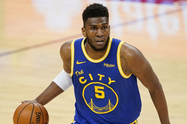 Golden State Warriors forward Kevon Looney (5) against the Phoenix Suns during the first half of an NBA basketball game, Thursday, Jan. 28, 2021, in Phoenix. (AP Photo/Matt York)