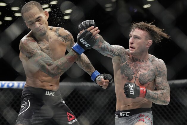 Gregor Gillespie, right, punches Yancy Medeiros during the second round of a lightweight mixed martial arts bout at UFC Fight Night on Saturday, Jan. 19, 2019, in New York. Gillespie won the fight. (AP Photo/Frank Franklin II)