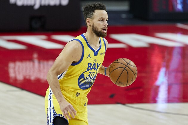 Golden State Warriors guard Stephen Curry brings the ball up court against the Portland Trail Blazers during the first half of an NBA basketball game in Portland, Ore., Wednesday, March 3, 2021. (AP Photo/Craig Mitchelldyer)