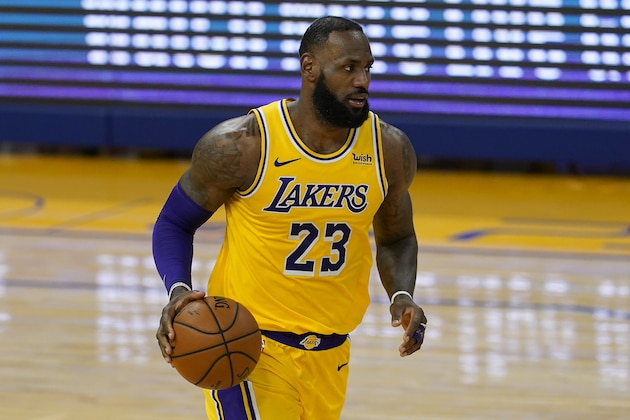 Los Angeles Lakers forward LeBron James (23) dribbles the ball up the court against the Golden State Warriors during the first half of an NBA basketball game in San Francisco, Monday, March 15, 2021. (AP Photo/Jeff Chiu)