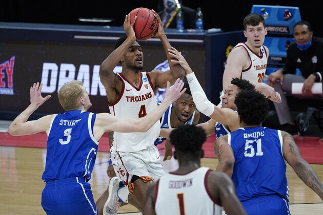 USC forward Evan Mobley (4) drives against Drake during the first half of a men's college basketball game in the first round of the NCAA tournament at Bankers Life Fieldhouse in Indianapolis, Saturday, March 20, 2021. (AP Photo/Paul Sancya) USC forward Evan Mobley (4) drives against Drake during the first half of a men's college basketball game in the first round of the NCAA tournament at Bankers Life Fieldhouse in Indianapolis, Saturday, March 20, 2021. (AP Photo/Paul Sancya)