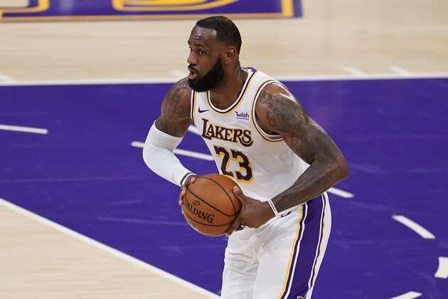 Los Angeles Lakers forward LeBron James (23) holds the ball during the first half of an NBA basketball game against the Atlanta Hawks Saturday, March 20, 2021, in Los Angeles. (AP Photo/Marcio Jose Sanchez)