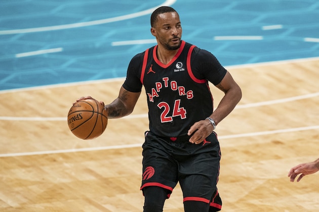Toronto Raptors guard Norman Powell (24) brings the ball up court against the Charlotte Hornets during the second half of an NBA basketball game in Charlotte, N.C., Saturday, March 13, 2021. (AP Photo/Jacob Kupferman)