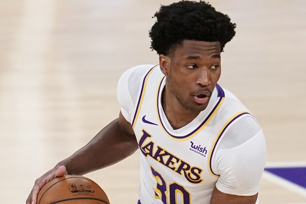Los Angeles Lakers center Damian Jones (30) holds the ball during the first half of an NBA basketball game against the Atlanta Hawks Saturday, March 20, 2021, in Los Angeles. (AP Photo/Marcio Jose Sanchez)