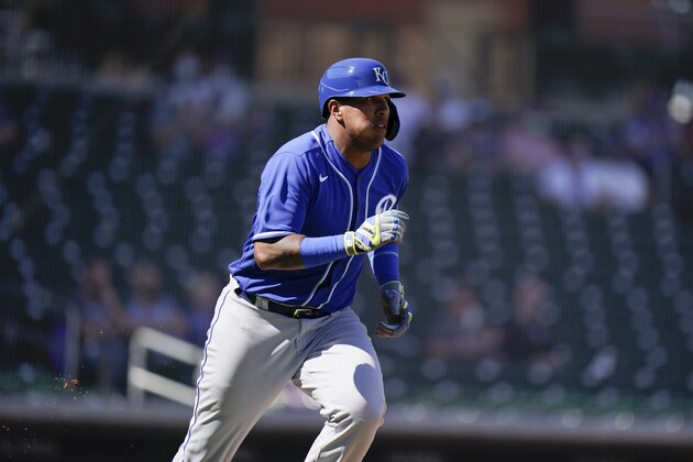 Kansas City Royals' Salvador Perez watches his fly ball during the first inning of a spring baseball game against the Chicago Cubs in Mesa, Ariz., Tuesday, March 2, 2021. (AP Photo/Jae C. Hong)