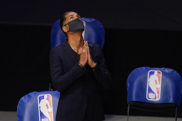 Los Angeles Lakers general manager Rob Pelinka reacts after getting his championship ring before an NBA basketball game against the Los Angeles Clippers Tuesday, Dec. 22, 2020, in Los Angeles. (AP Photo/Marcio Jose Sanchez)