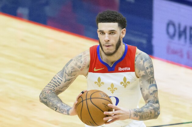 New Orleans Pelicans guard Lonzo Ball (2) passes in the second half of an NBA basketball game against the Cleveland Cavaliers in New Orleans, Friday, March 12, 2021. (AP Photo/Matthew Hinton)
