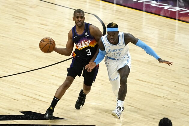 Phoenix Suns guard Chris Paul (3) drives around Los Angeles Lakers guard Dennis Schroder (17) during the second half of an NBA basketball game, Sunday, March 21, 2021, in Phoenix. (AP Photo/Rick Scuteri)
