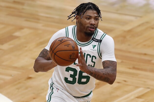 Boston Celtics' Marcus Smart plays against the Orlando Magic during the first half on an NBA basketball game, Sunday, March 21, 2021, in Boston. (AP Photo/Michael Dwyer)