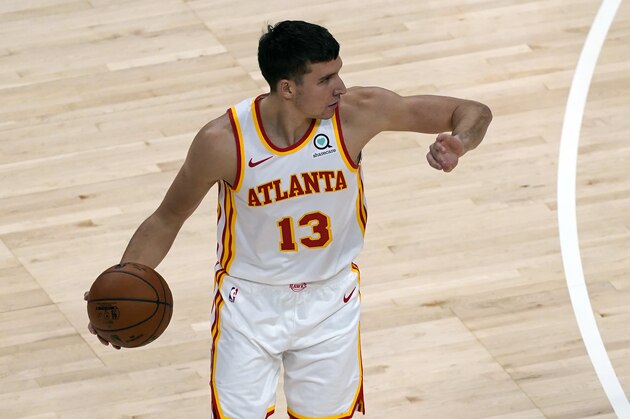 Atlanta Hawks guard Bogdan Bogdanovic (13) is shown against the Orlando Magic during the second half of an NBA basketball game Sunday, Dec. 13, 2020, in Atlanta. (AP Photo/John Bazemore)