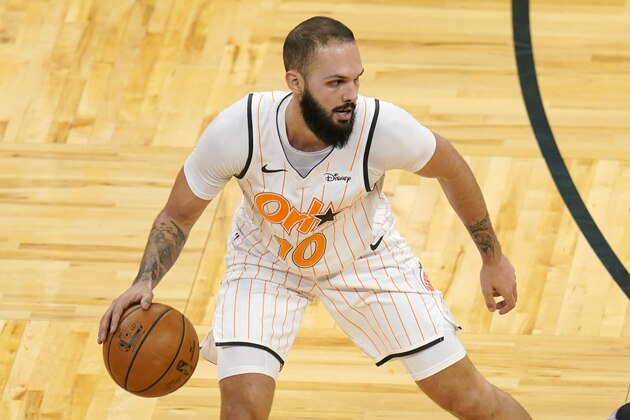 Orlando Magic guard Evan Fournier looks to pass the ball during the first half of an NBA basketball game against the Chicago Bulls, Friday, Feb. 5, 2021, in Orlando, Fla. (AP Photo/John Raoux)