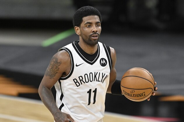 Brooklyn Nets' Kyrie Irving runs up the court during the second half of an NBA basketball game against the San Antonio Spurs, Monday, March 1, 2021, in San Antonio. Brooklyn won 124-113. (AP Photo/Darren Abate)