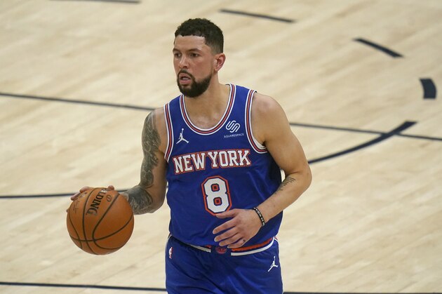 New York Knicks guard Austin Rivers (8) brings the ball up court in the second half during an NBA basketball game against the Utah Jazz Tuesday, Jan. 26, 2021, in Salt Lake City. (AP Photo/Rick Bowmer)