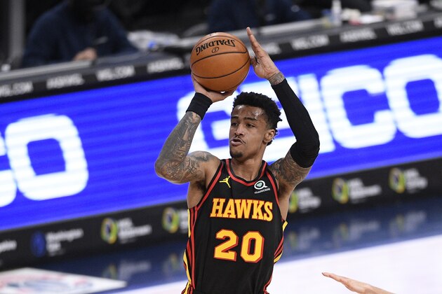 Atlanta Hawks forward John Collins (20) shoots during the first half of an NBA basketball game against the Washington Wizards, Friday, Jan. 29, 2021, in Washington. (AP Photo/Nick Wass)