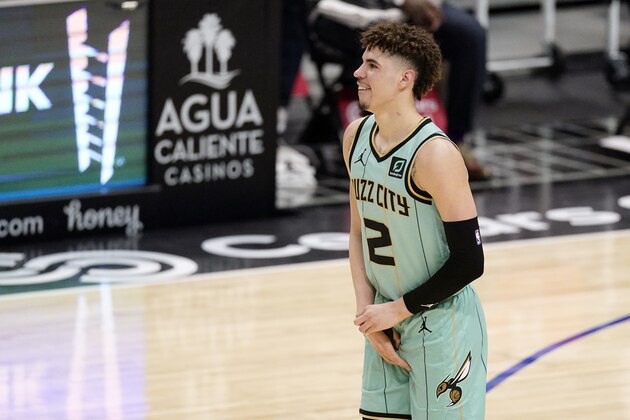 Charlotte Hornets guard LaMelo Ball holds his right wrist during the second half of an NBA basketball game against the Los Angeles Clippers Saturday, March 20, 2021, in Los Angeles. Ball is expected to miss the rest of the season due to a broken right wrist, according to a person familiar with the situation. The person spoke to The Associated Press on Sunday on condition of anonymity because the team has not made the status of his injury public. He appeared to be hurt after a fall in the Hornets' 125-98 loss to the Clippers in Los Angeles on Saturday. (AP Photo/Mark J. Terrill)