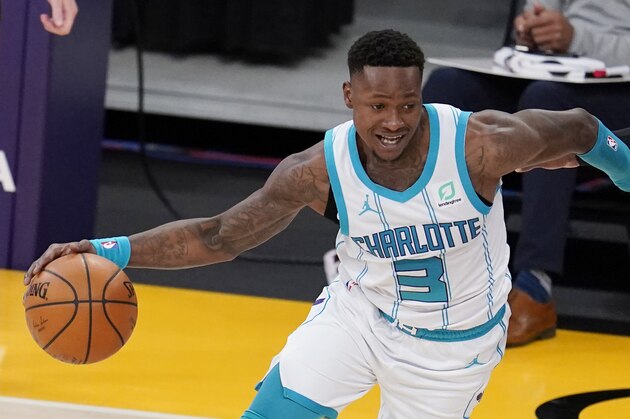 Charlotte Hornets guard Terry Rozier dribbles during an NBA basketball game against the Los Angeles Lakers Thursday, March 18, 2021, in Los Angeles. (AP Photo/Marcio Jose Sanchez)