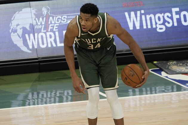 Milwaukee Bucks' Giannis Antetokounmpo dribbles during the first half of an NBA basketball game against the San Antonio SpursSaturday, March 20, 2021, in Milwaukee. (AP Photo/Morry Gash)