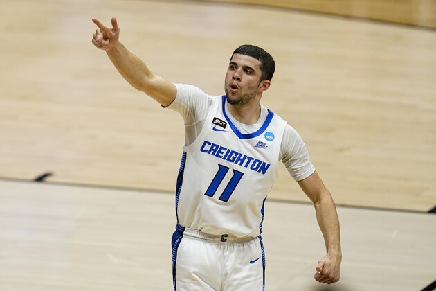 Creighton guard Marcus Zegarowski (11) celebrates a three-point basket against Ohio in the first half of a second-round game in the NCAA men's college basketball tournament at Hinkle Fieldhouse in Indianapolis, Monday, March 22, 2021. (AP Photo/Michael Conroy)