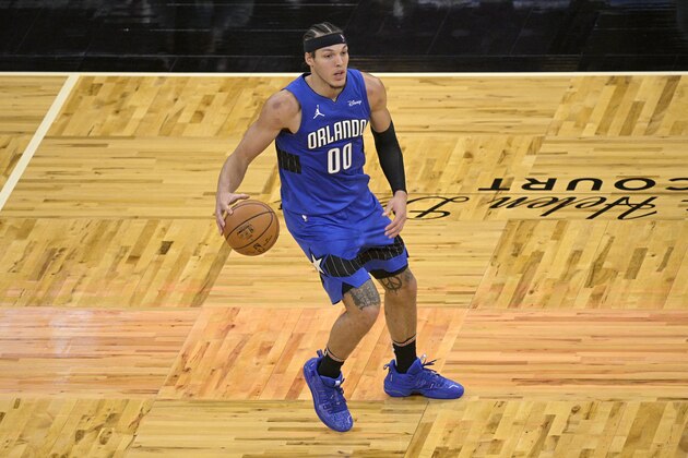 Orlando Magic forward Aaron Gordon (00) looks to pass the ball during the second half of an NBA basketball game against the Sacramento Kings, Wednesday, Jan. 27, 2021, in Orlando, Fla. (AP Photo/Phelan M. Ebenhack)