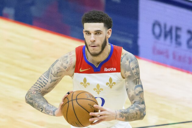 New Orleans Pelicans guard Lonzo Ball (2) passes in the second half of an NBA basketball game against the Cleveland Cavaliers in New Orleans, Friday, March 12, 2021. (AP Photo/Matthew Hinton)