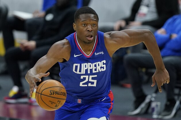 Los Angeles Clippers' Mfiondu Kabengele drives in the second half of an NBA basketball game against the Cleveland Cavaliers, Wednesday, Feb. 3, 2021, in Cleveland. (AP Photo/Tony Dejak)
