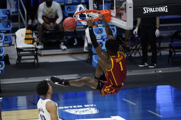 USC forward Chevez Goodwin (1) dunks on Kansas forward Jalen Wilson (10) during the second half of a men's college basketball game in the second round of the NCAA tournament at Hinkle Fieldhouse in Indianapolis, Monday, March 22, 2021. (AP Photo/Paul Sancya)