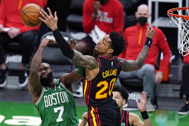 Atlanta Hawks forward John Collins (20) blocks a shot by Boston Celtics guard Jaylen Brown (7) during the second half of an NBA basketball game, Wednesday, Feb. 17, 2021, in Boston. (AP Photo/Charles Krupa)